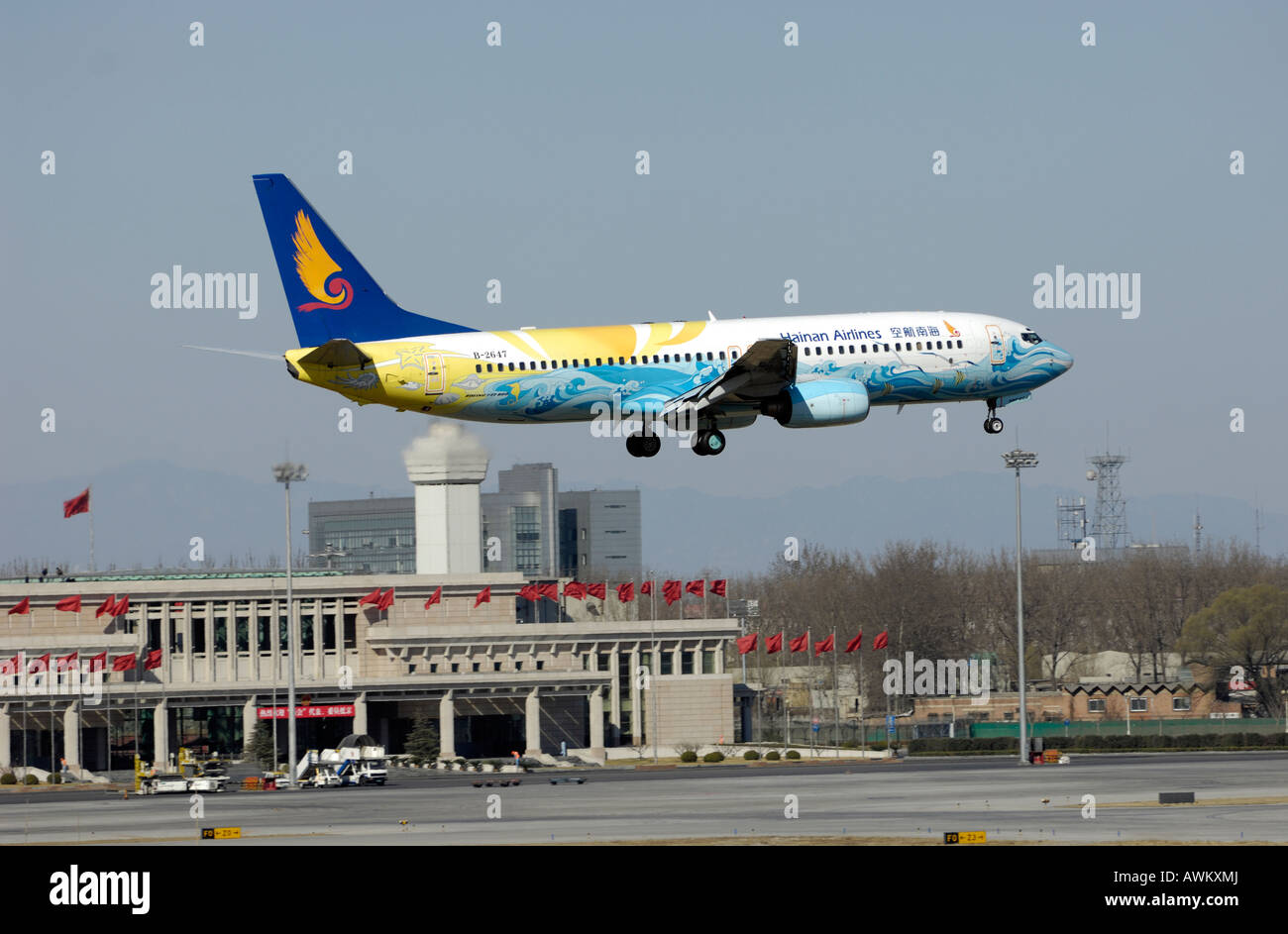 Hainan Airlines plane begins its descent into Beijing International Airport in Beijing, China. 13-Mar-2008 Stock Photo