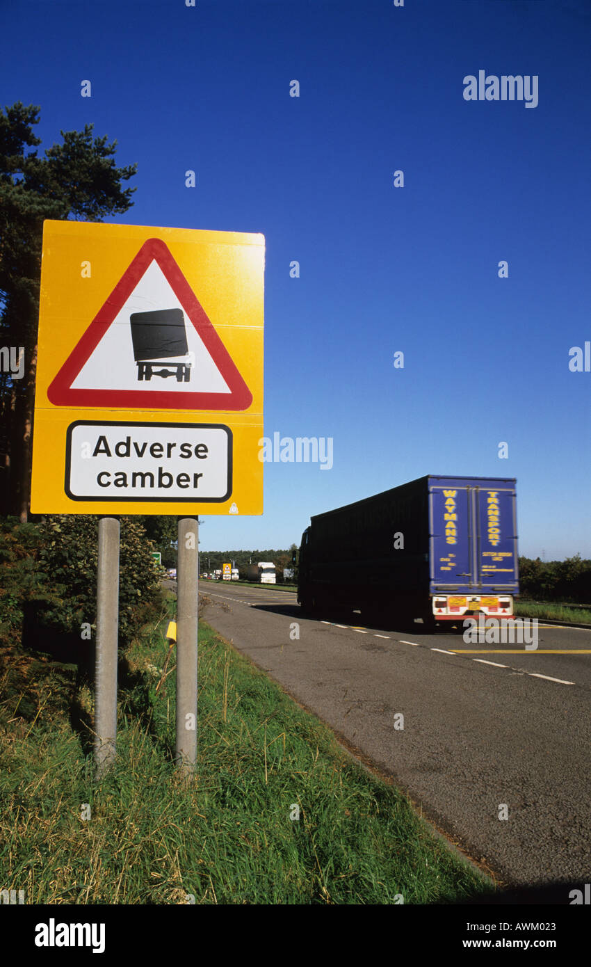lorry passing warning sign of adverse camber on road surface a1 road