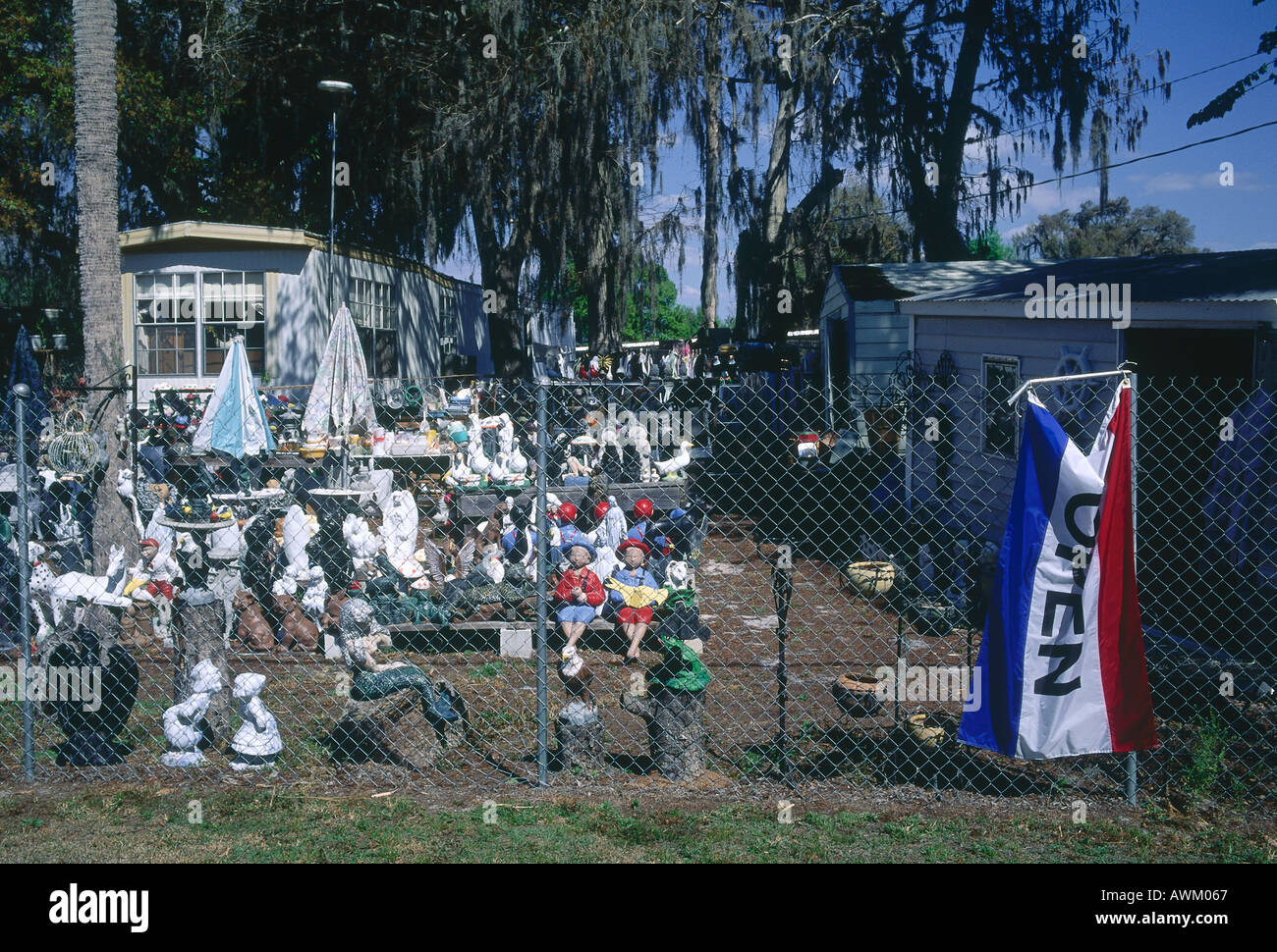 Junkyard sale behind chainlink fence, Okeechobee, Florida, USA Stock Photo