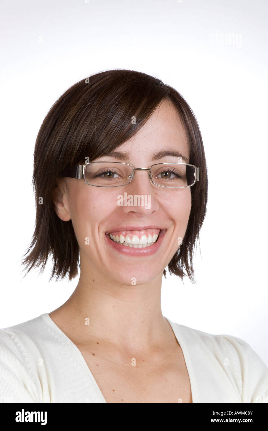 Young woman wearing glasses, laughing Stock Photo