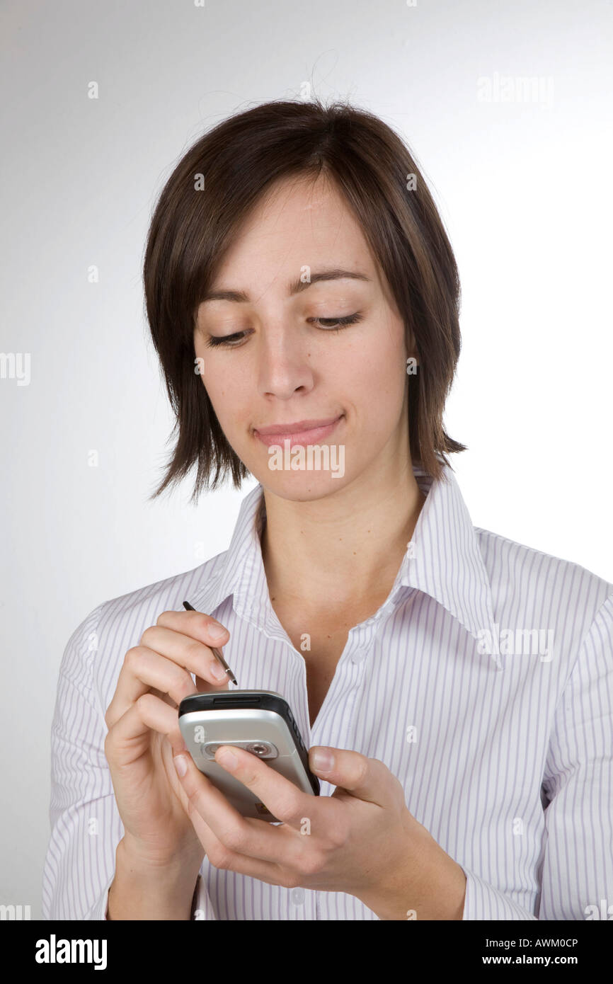 Young woman using a PDA Stock Photo Alamy
