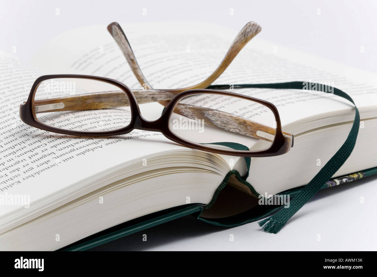 Reading glasses on a book Stock Photo