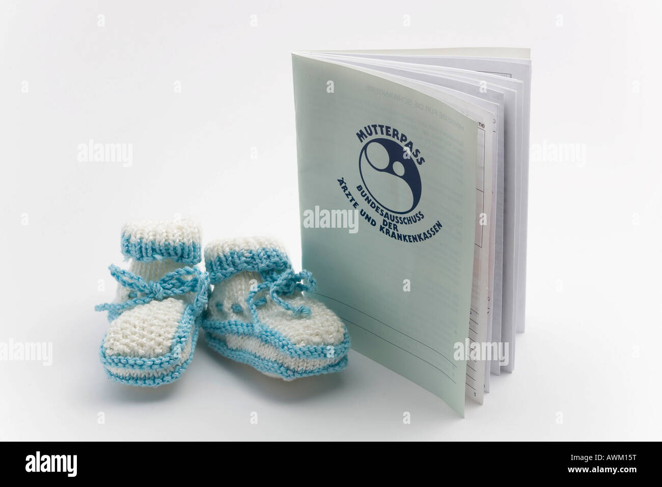 Maternity card with baby shoes Stock Photo Alamy