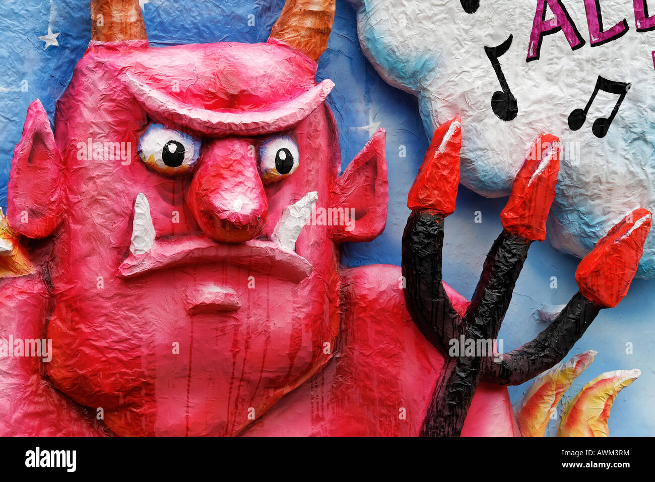 Paper-maché devil holding pitchfork, Carnival (Mardi Gras) parade in Duesseldorf, North Rhine-Westphalia, Germany, Europe Stock Photo