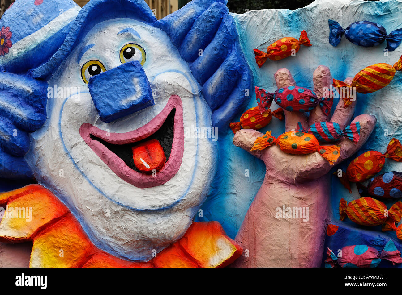 Papermaché clown throwing candy, Carnival (Mardi Gras) parade in