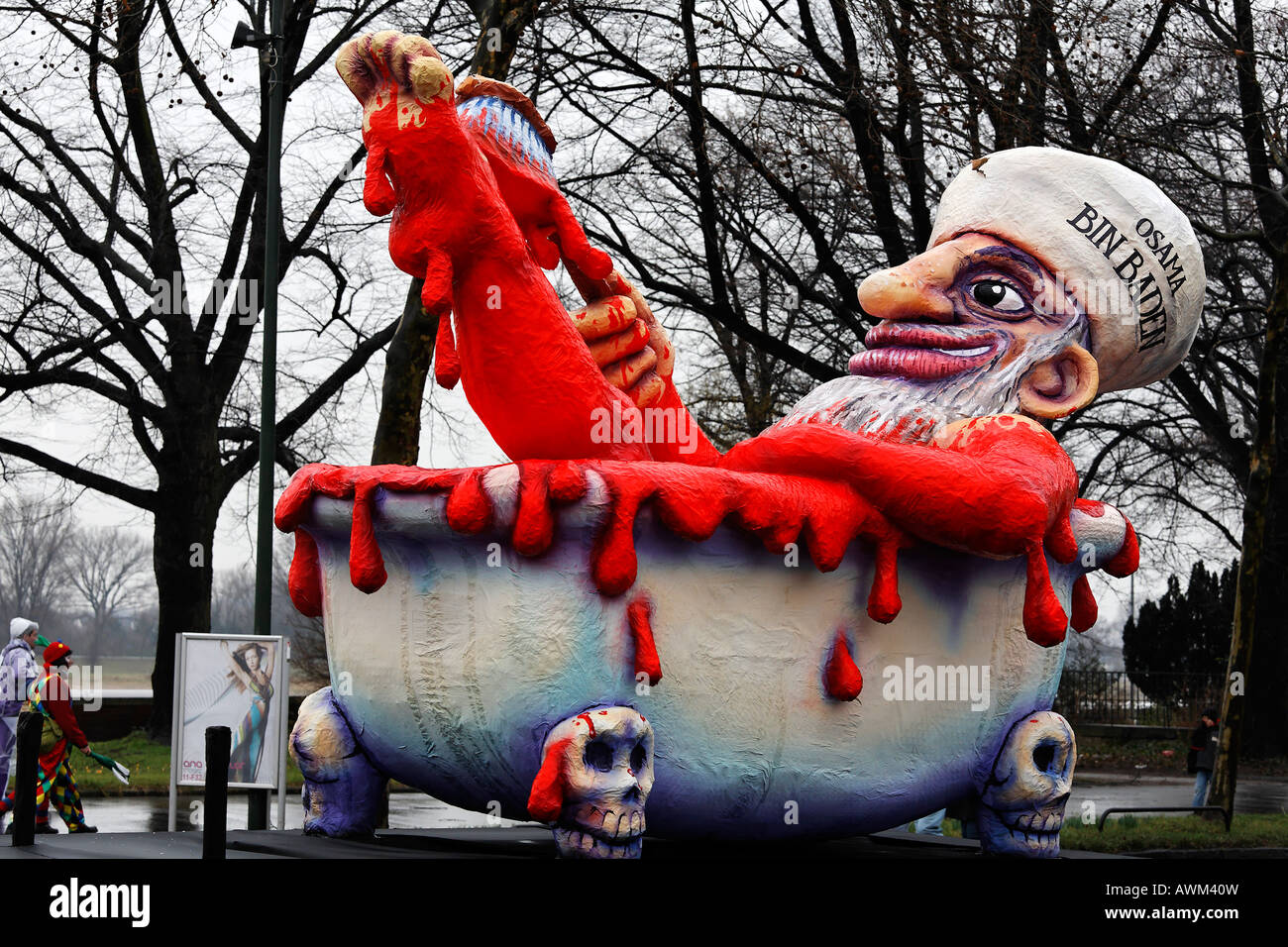Political caricature, paper-maché Osama Bin Laden bathing in blood, Carnival (Mardi Gras) parade in Duesseldorf, North Rhine-We Stock Photo