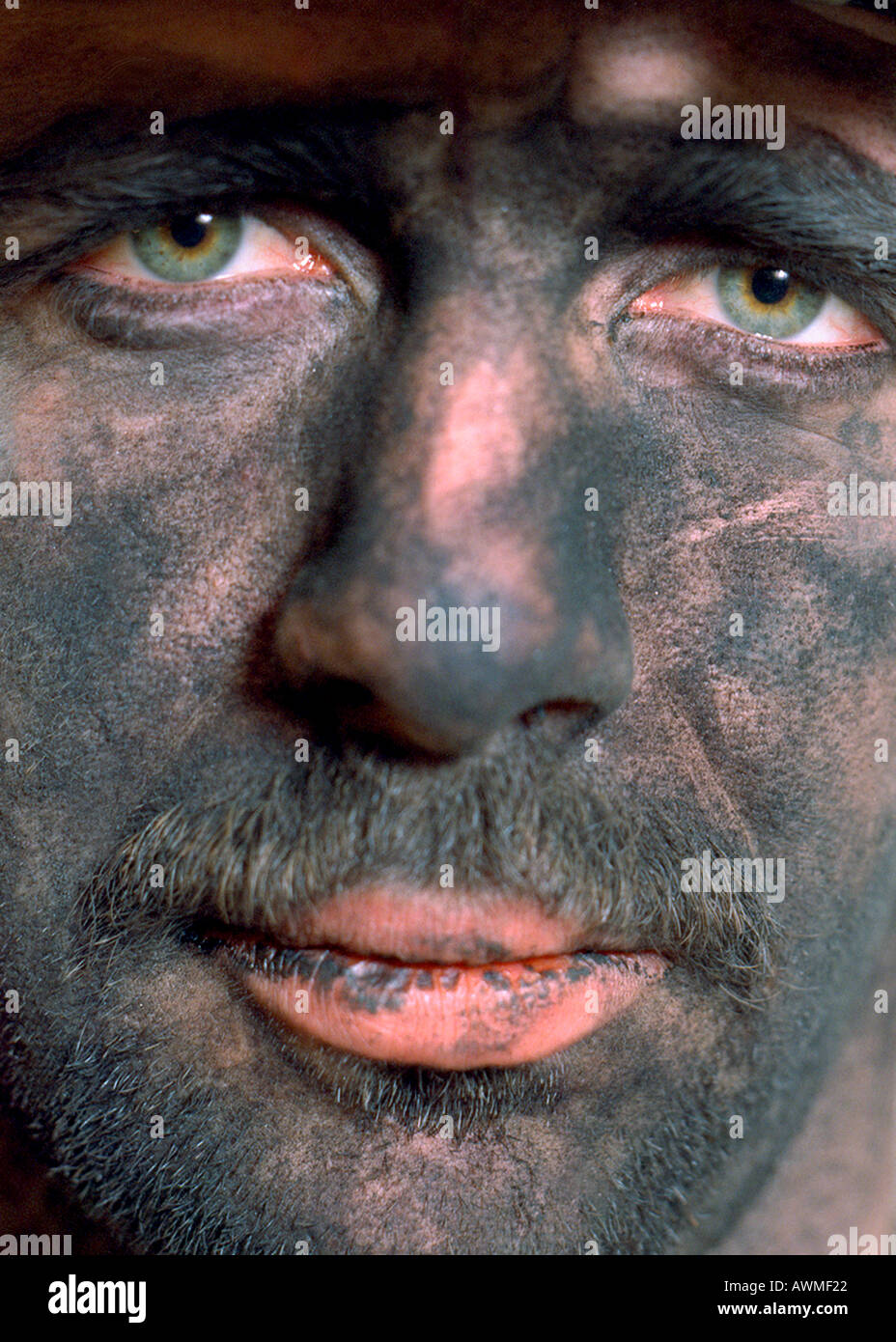 Close-up of male coal miner looking grime Stock Photo
