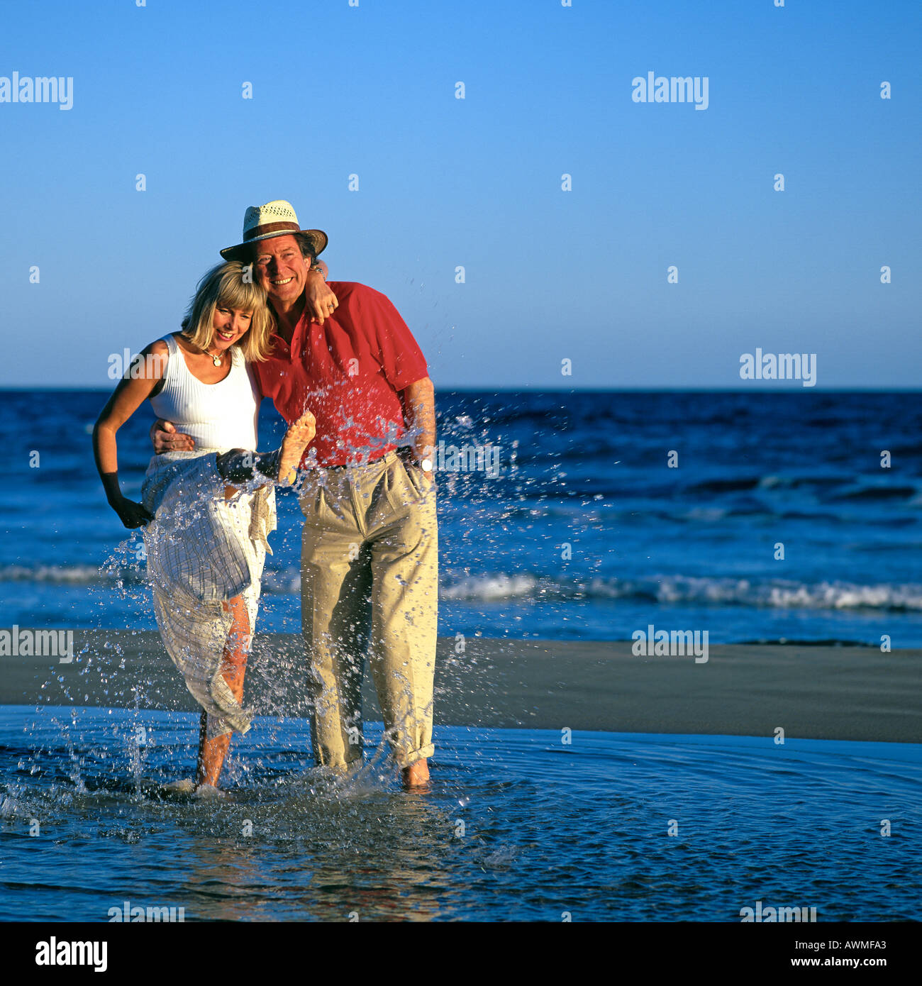 Mature Couple Splashing In Sea Stock Image Mature Couple Splashing In Sea Stock Image