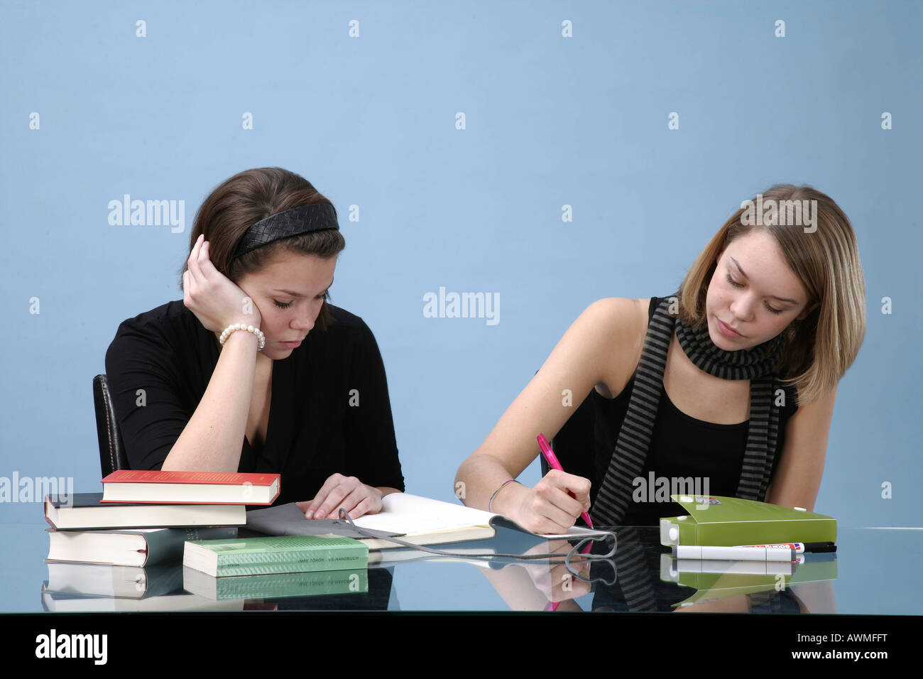Two young girls doing homework together Stock Photo