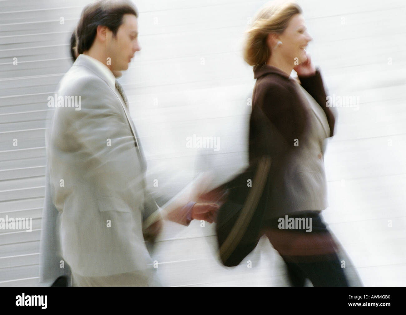 Business people walking, side view, blurred Stock Photo - Alamy