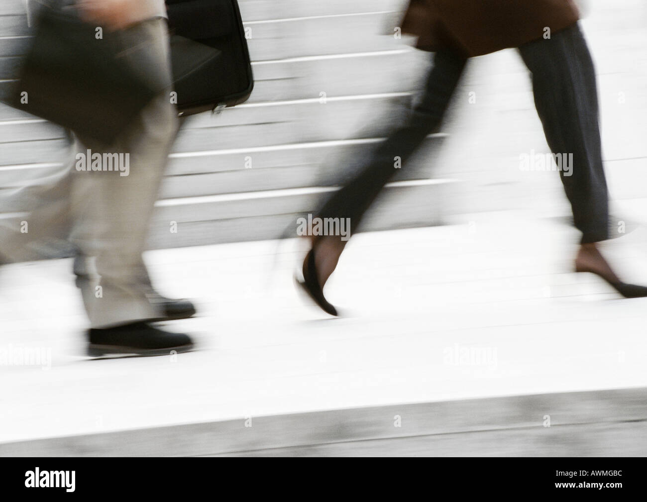 Business people running in street, low section, blurred Stock Photo