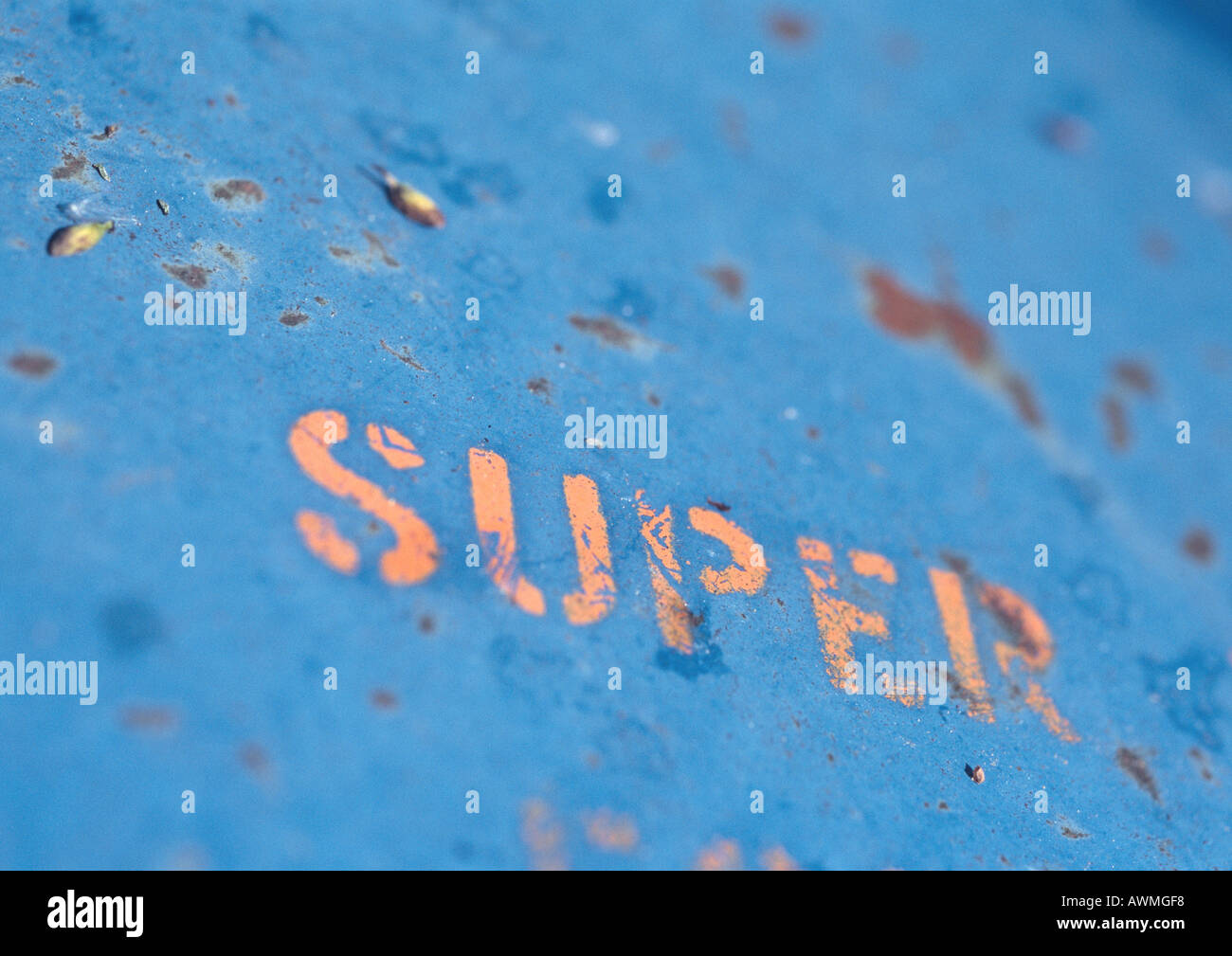 Super text stenciled on rusty surface, close-up Stock Photo