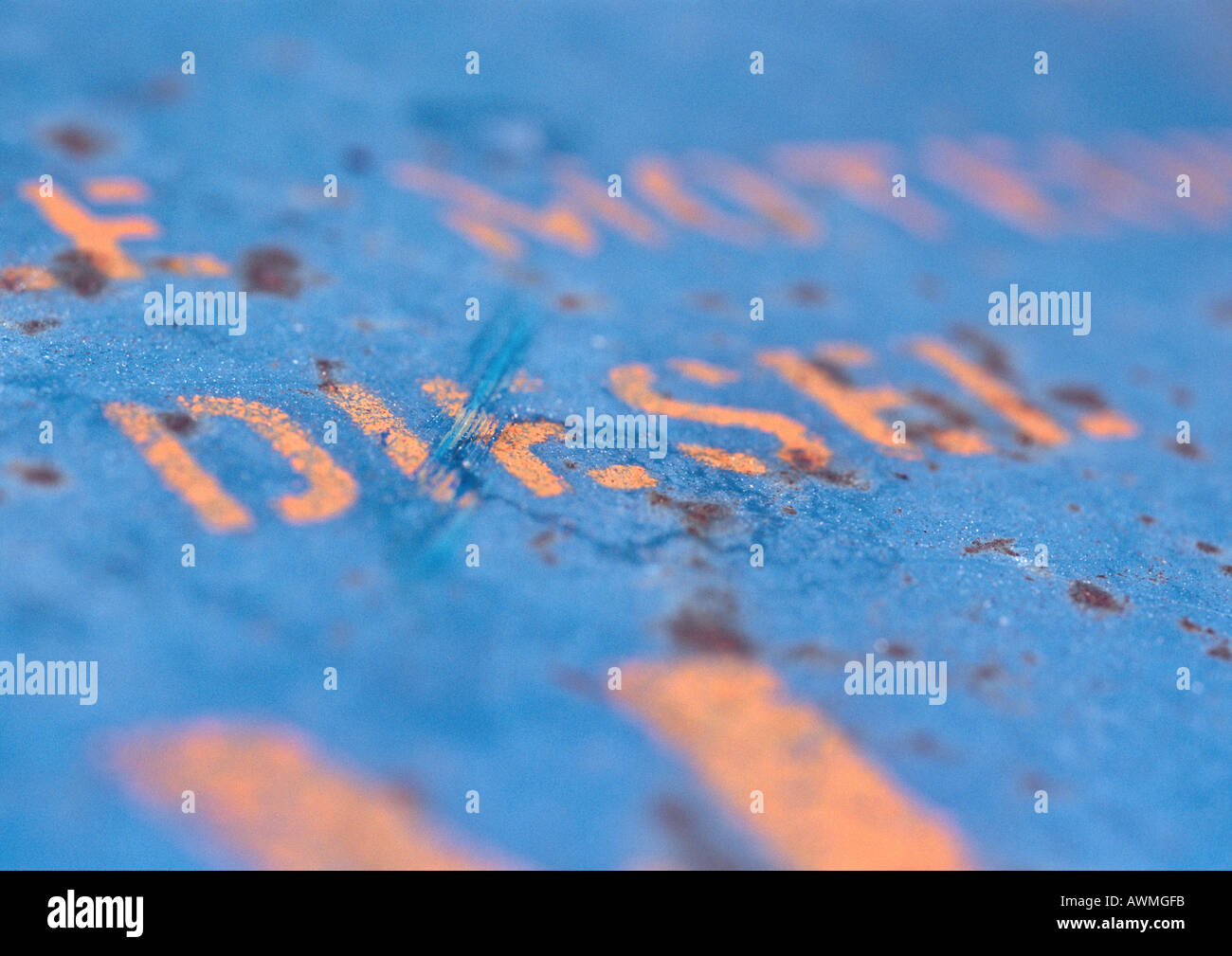 Diesel text stenciled on rusty surface, close-up Stock Photo