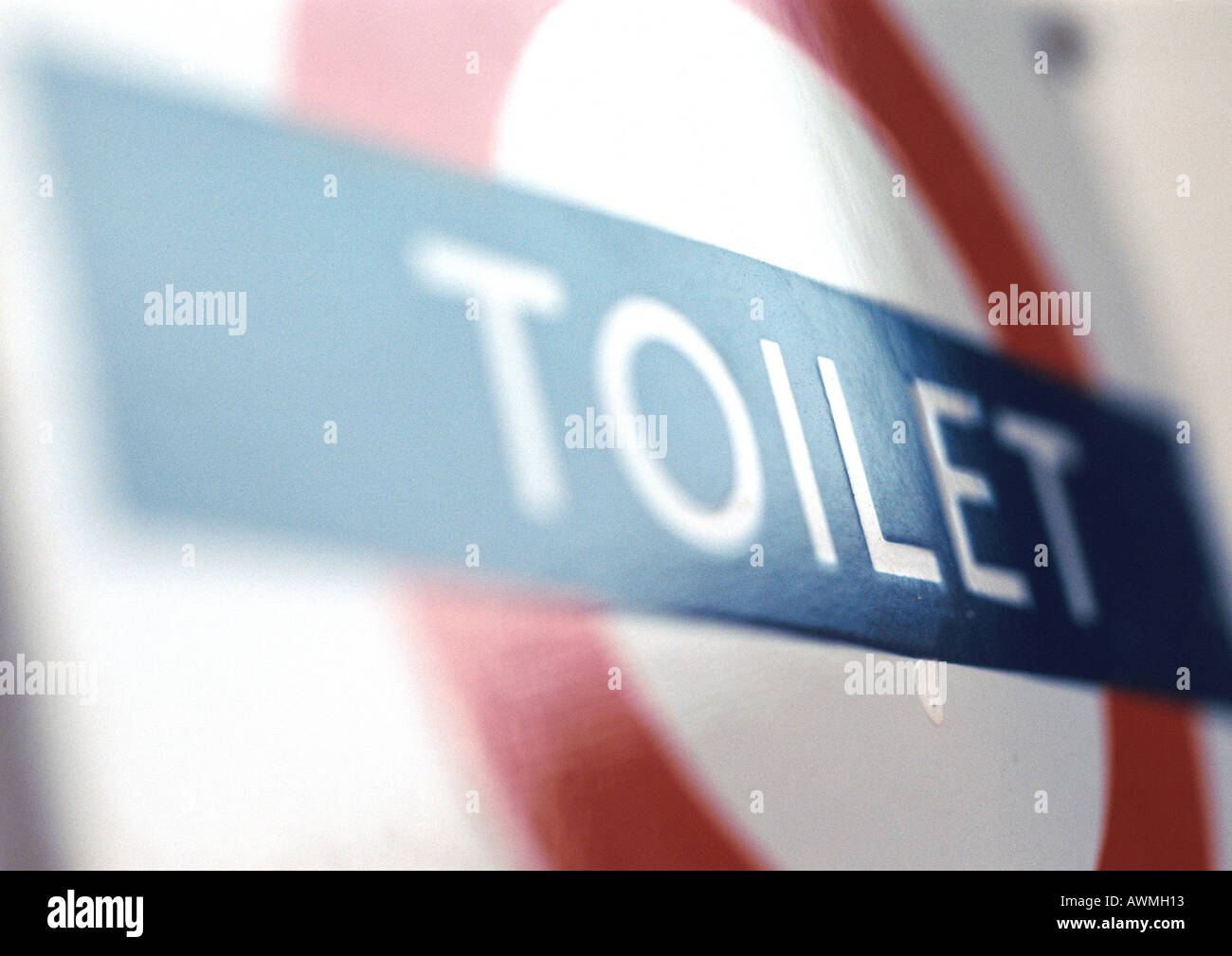 Toilet text on sign, close-up, blurred Stock Photo