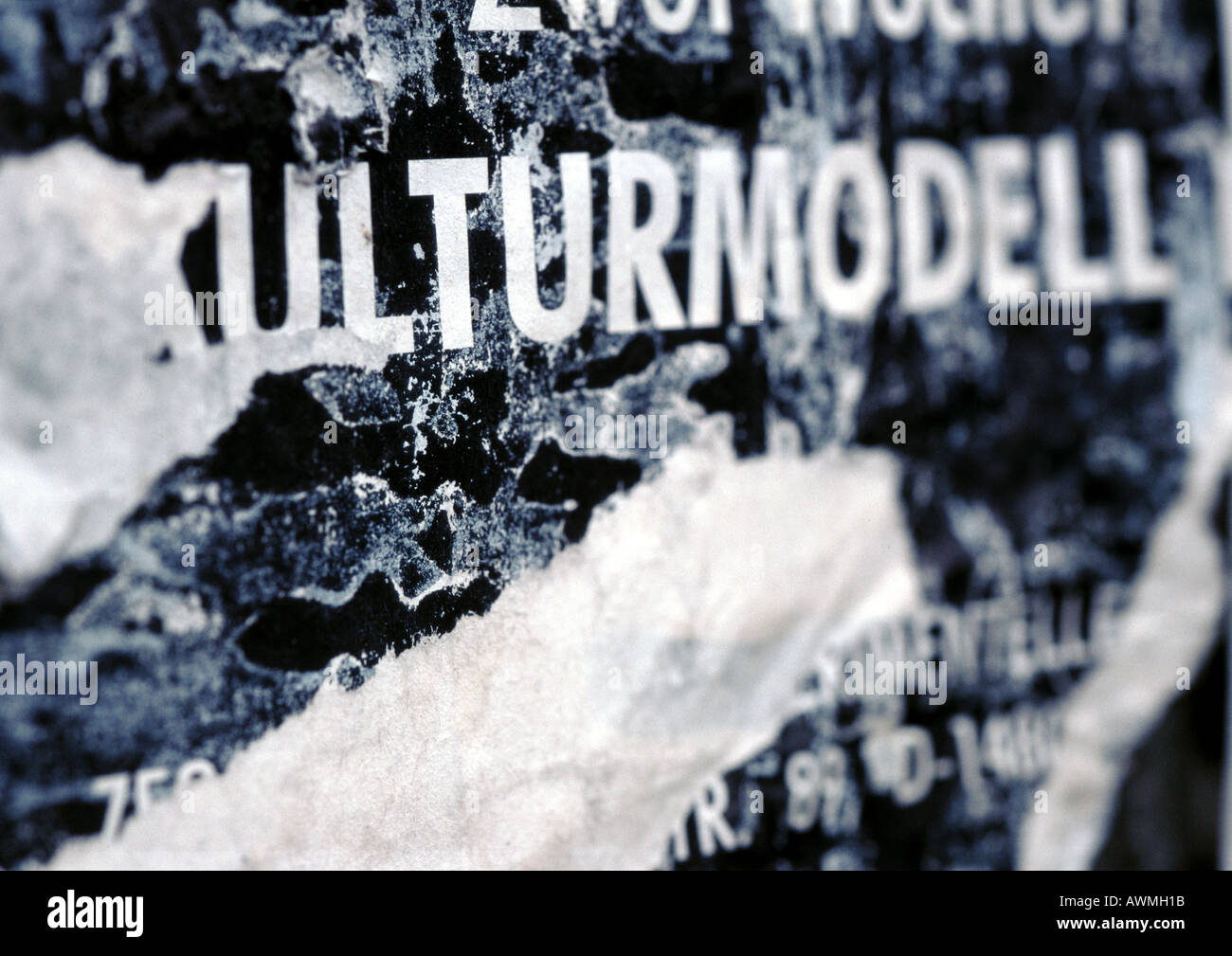 Cultural model text in German printed on torn poster, close-up Stock Photo