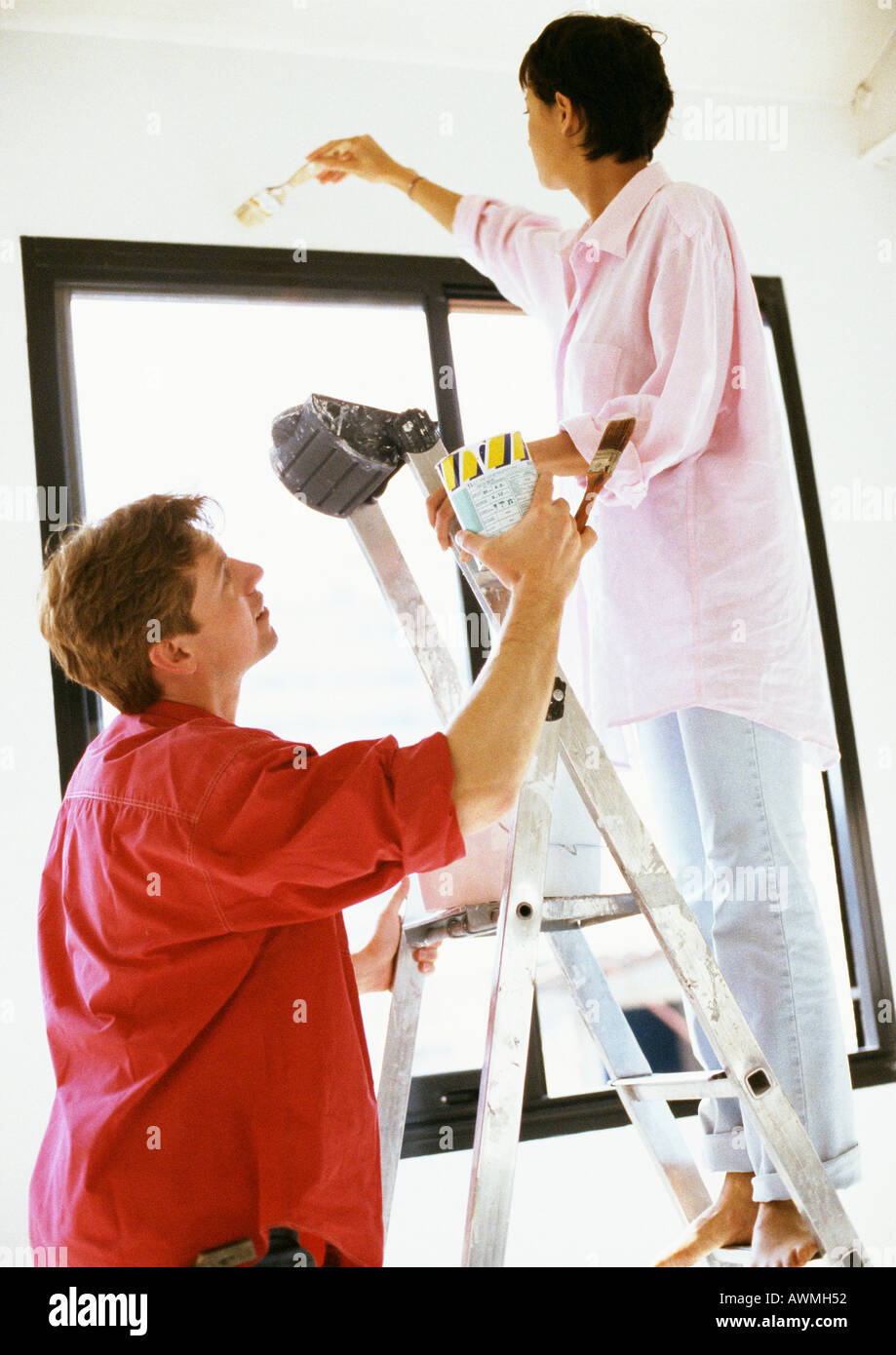 Man up ladder painting window hi-res stock photography and images - Alamy