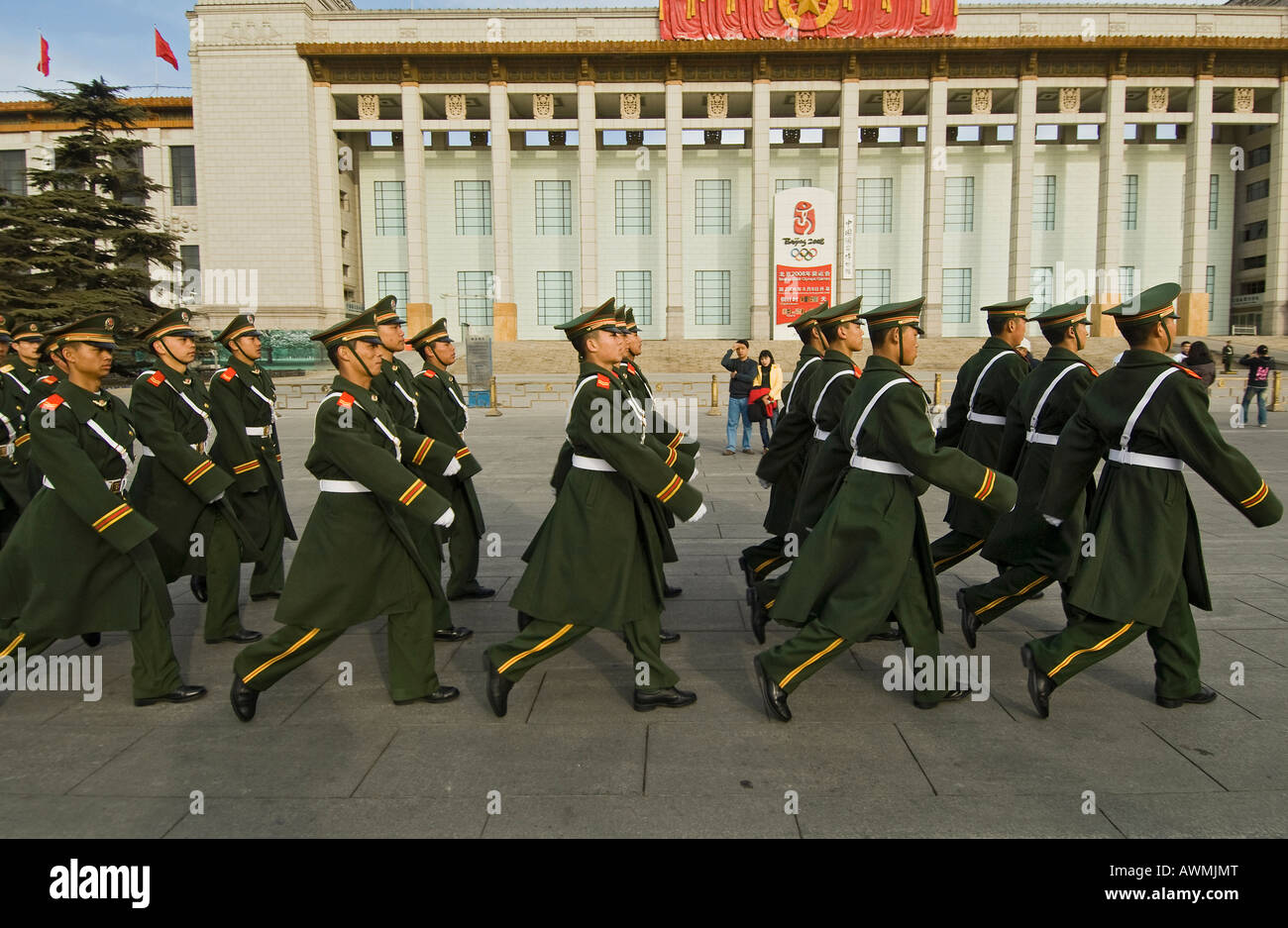 Peoples Armed Police march to their barracks past the Olympic countdown clock outside the National Museum near Tiananmen square Stock Photo
