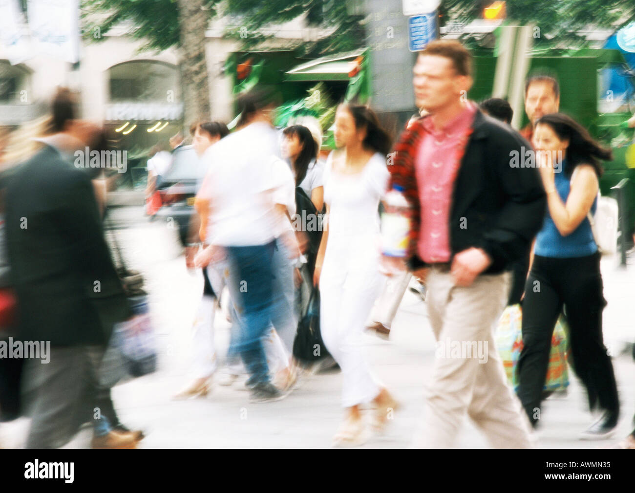 People walking in street, blurred Stock Photo - Alamy