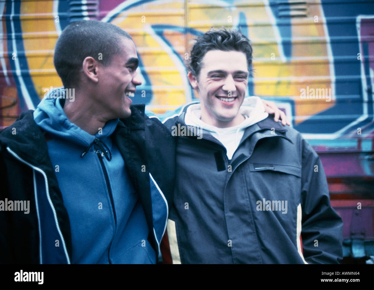 One with arm around the other hi-res stock photography and images - Alamy