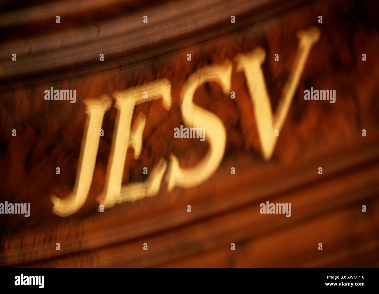 Jesus inscribed in Latin, close-up, blurred Stock Photo