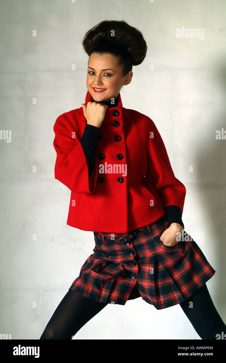 Young Woman Wearing Retro Sixties Outfit With Her Hair Done In An