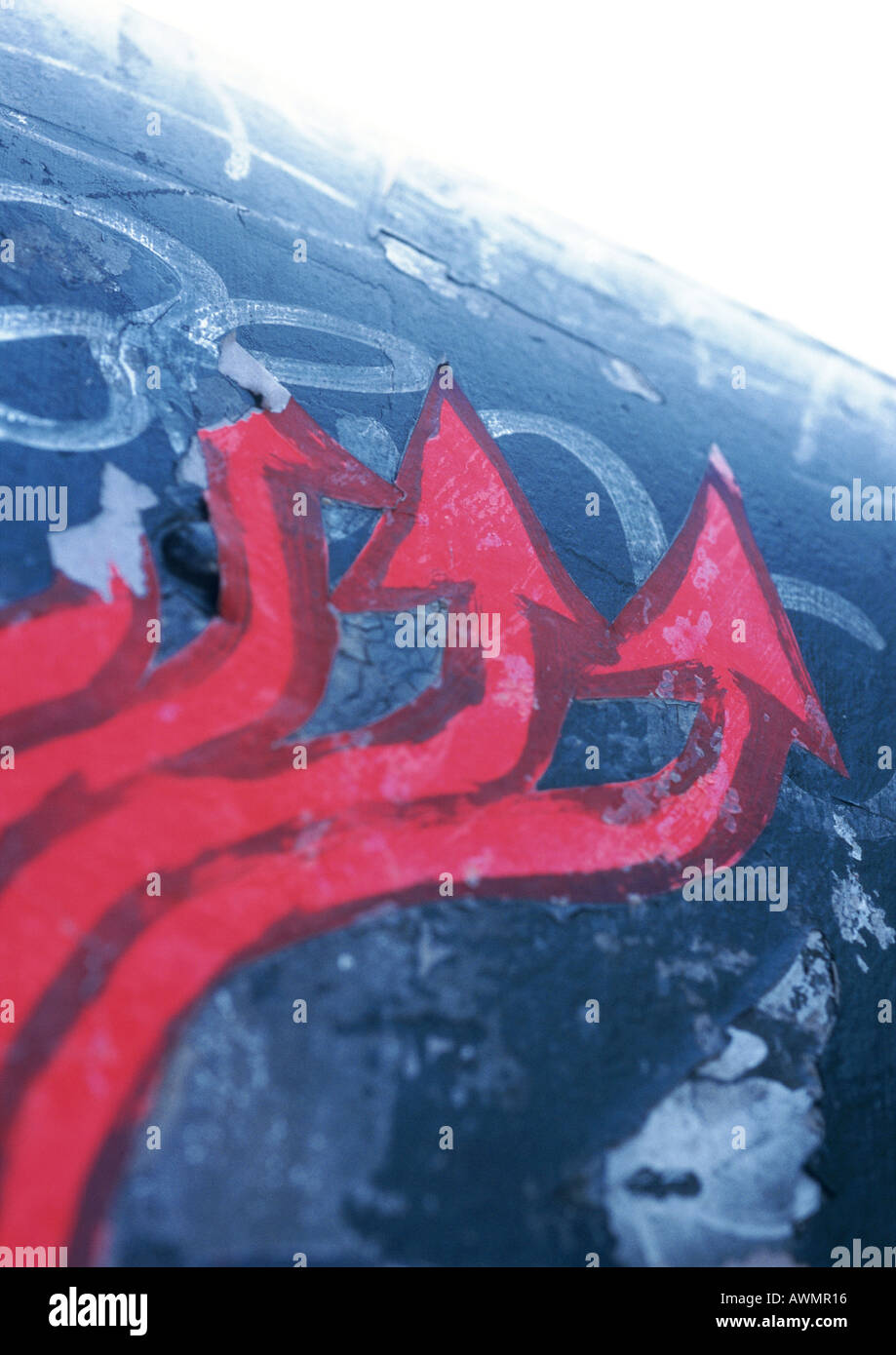 Red arrows painted on wall, close-up Stock Photo