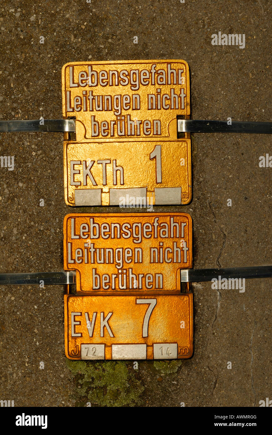 Warnig signs on a power pole. Stock Photo