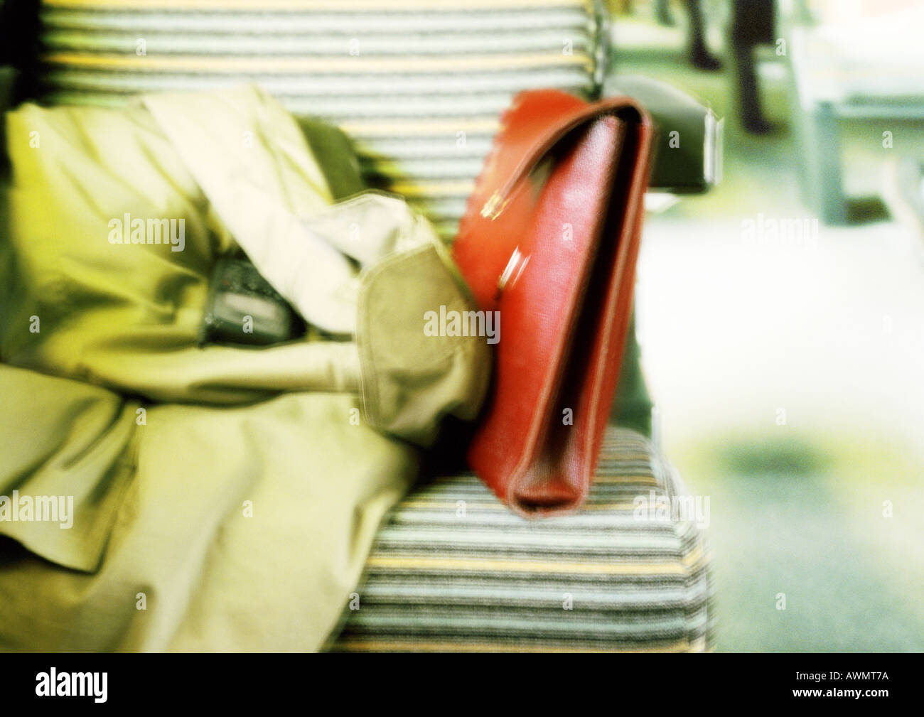Coat and purse on seat, blurred Stock Photo