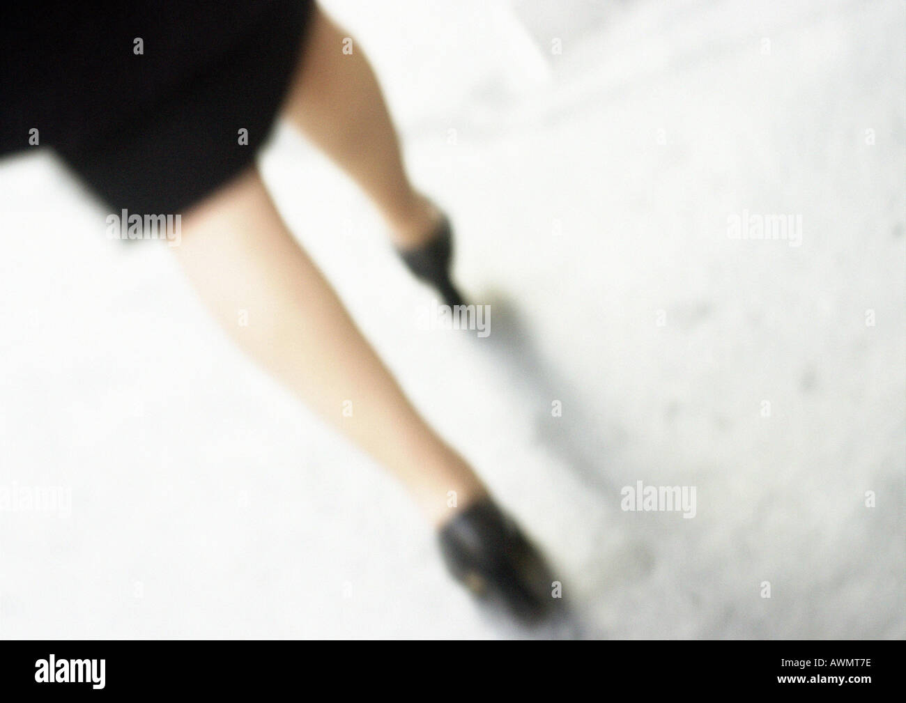 Woman walking, lower section, close-up, blurred. Stock Photo