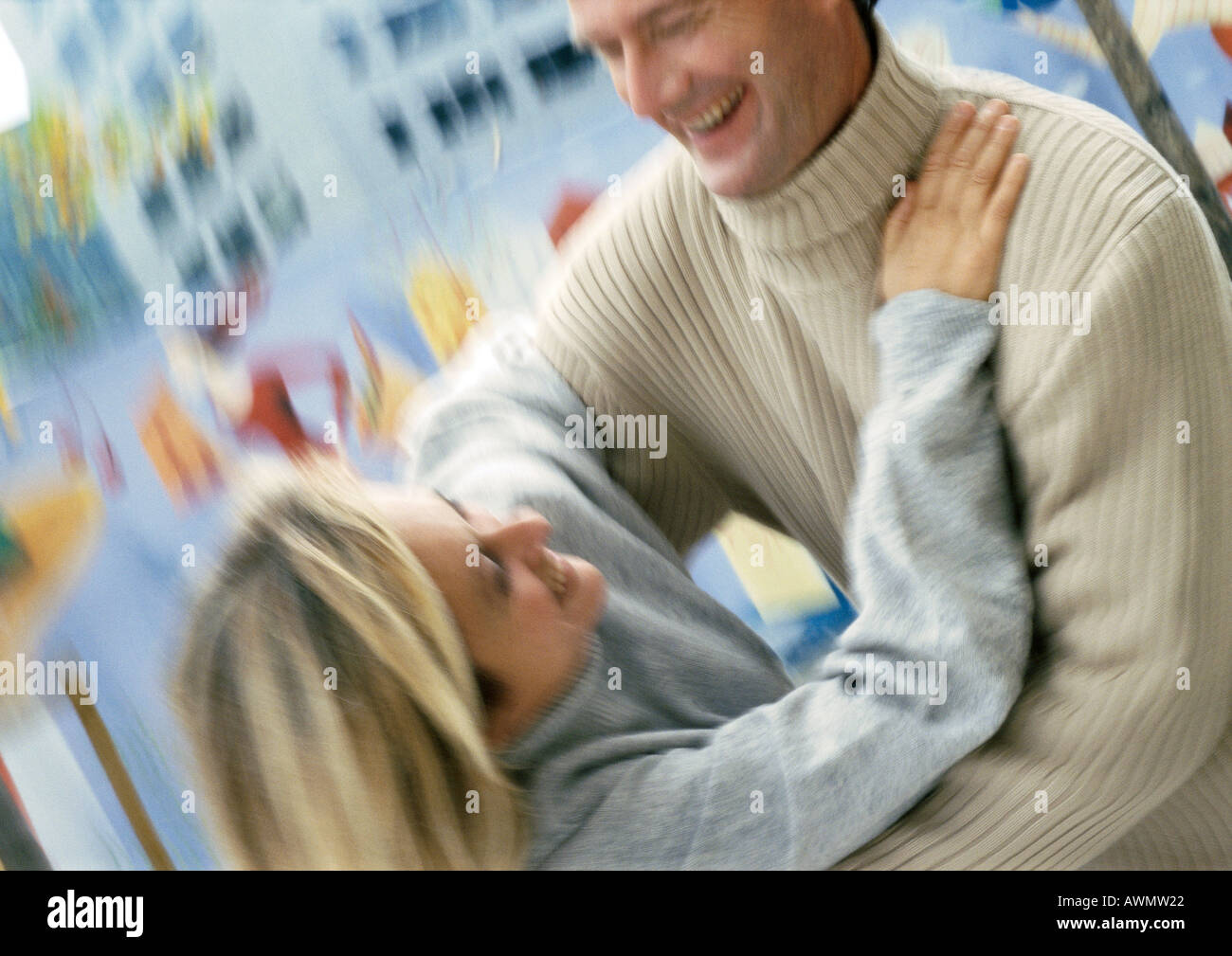 Man and woman holding each other, blurred Stock Photo