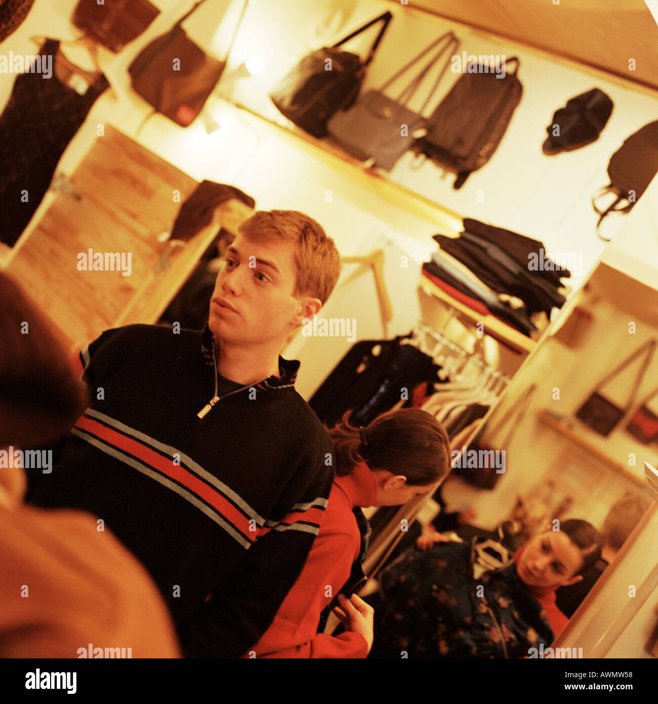 Young people in clothing store Stock Photo - Alamy