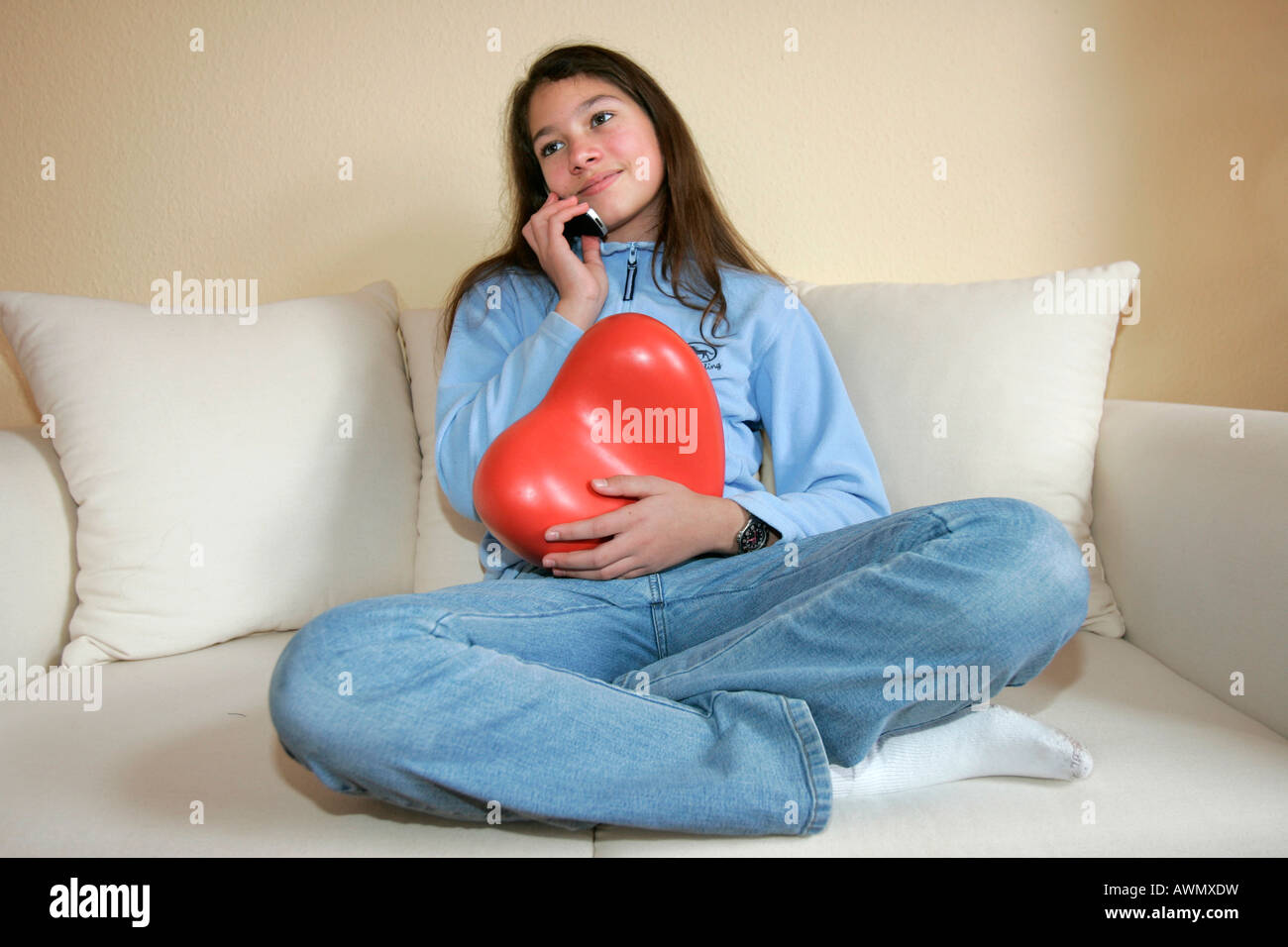 Teenager talking on a mobile phone, Hesse, Germany, Europe Stock Photo