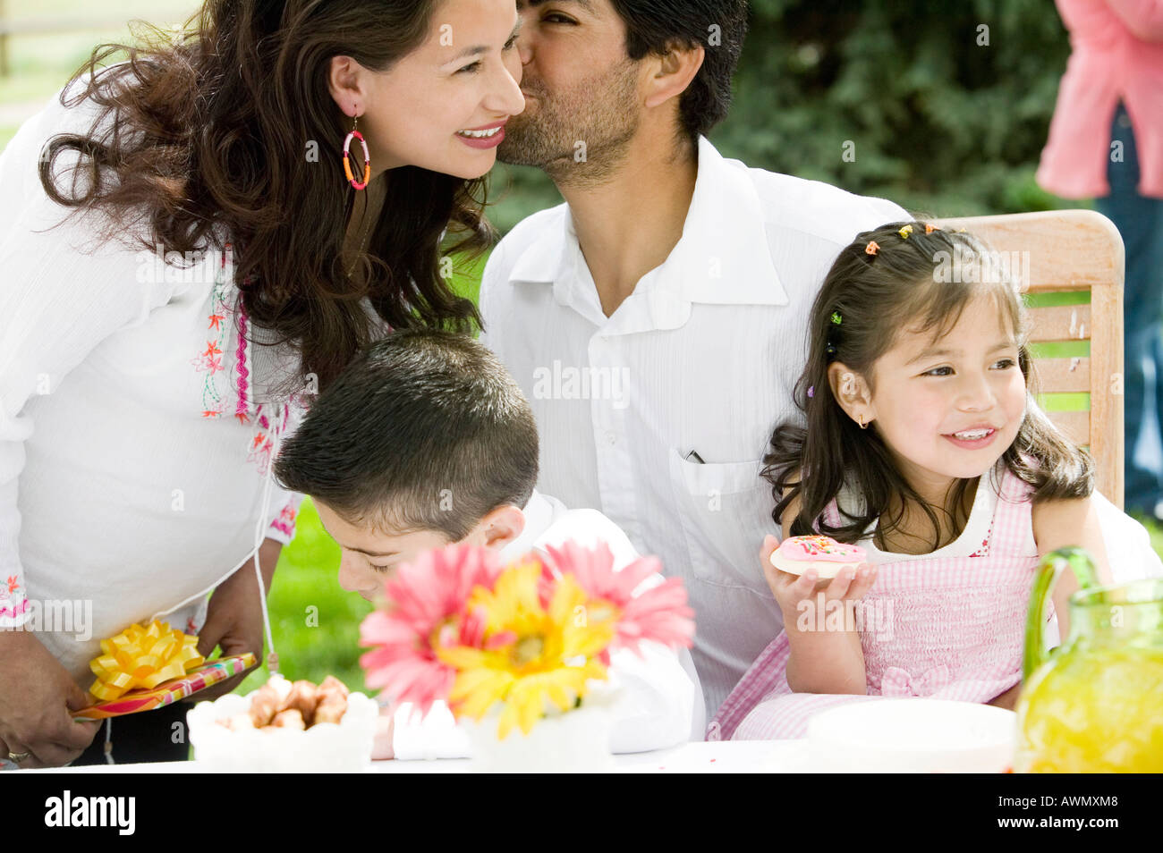 Hispanic family at outdoor party Stock Photo