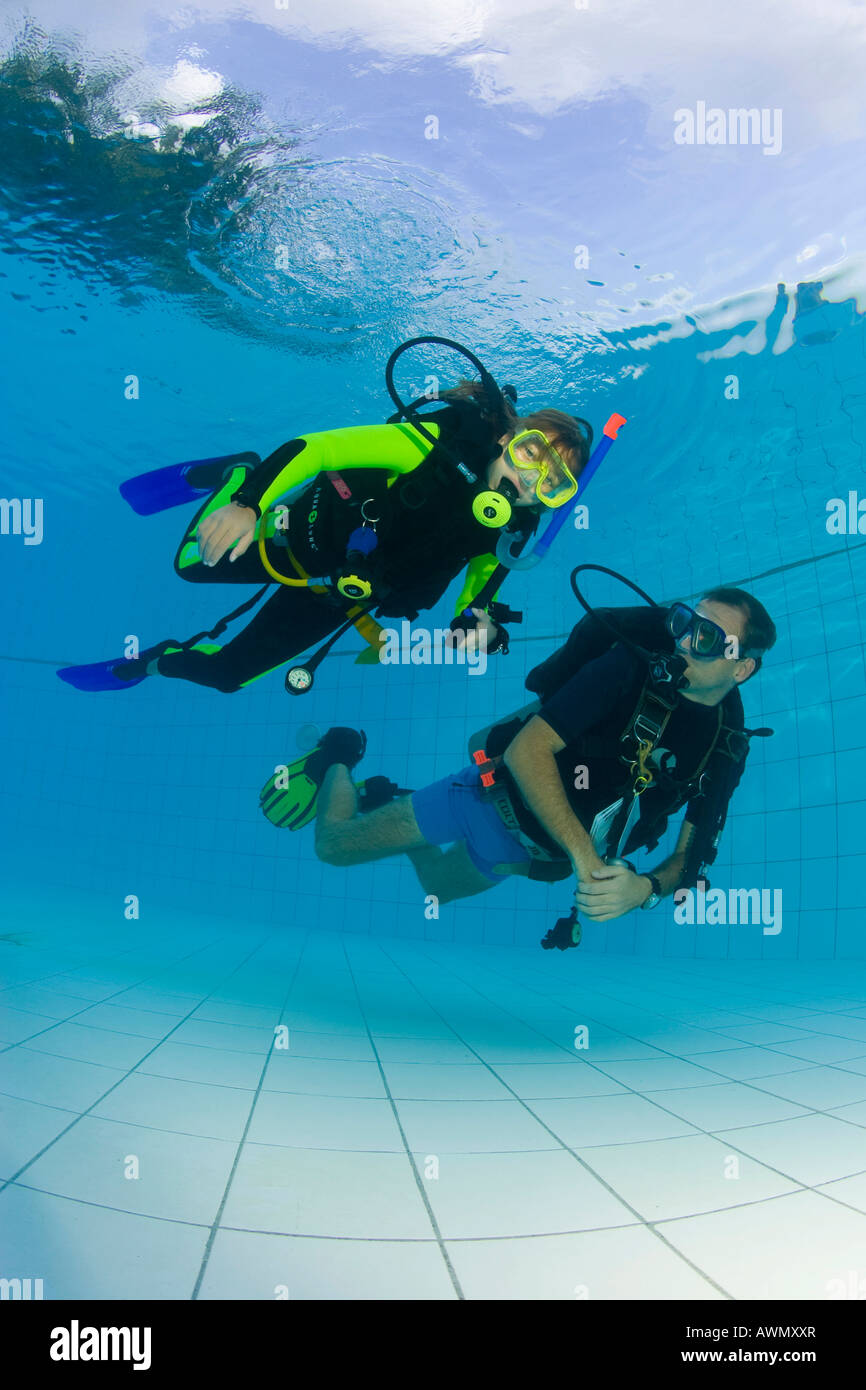 A girl is doing a diving training in the swimmingpool, Indonesia Stock