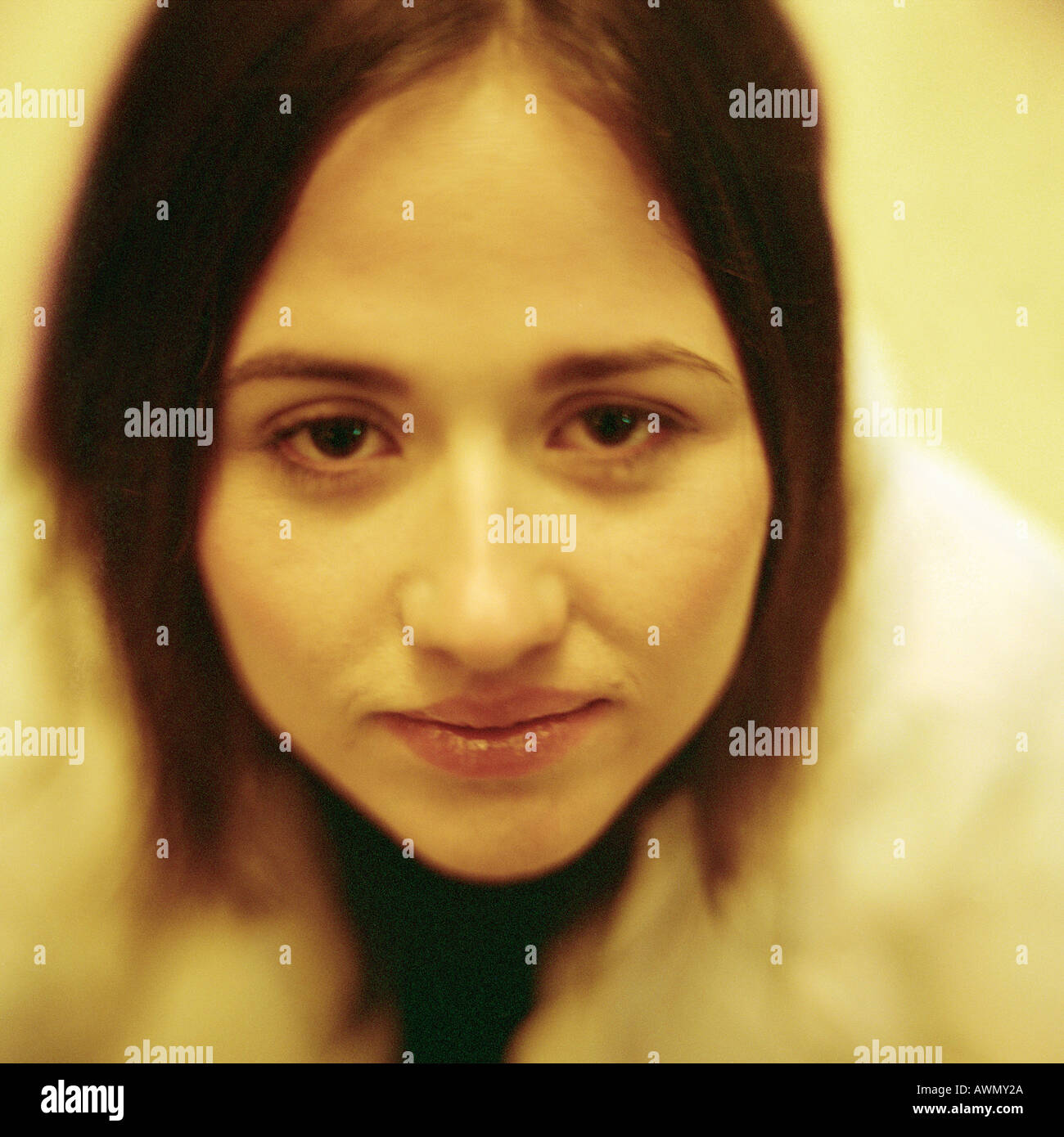 Young woman looking at camera, close-up, portrait. Stock Photo