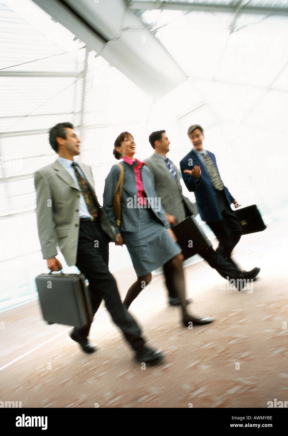 Group of business people walking together indoors, blurred Stock Photo ...