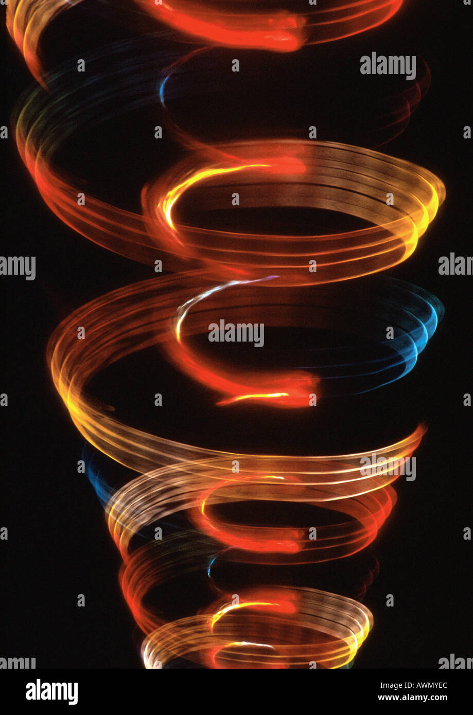 Spiraling light effect, one within the other, oranges, reds and blues. Stock Photo