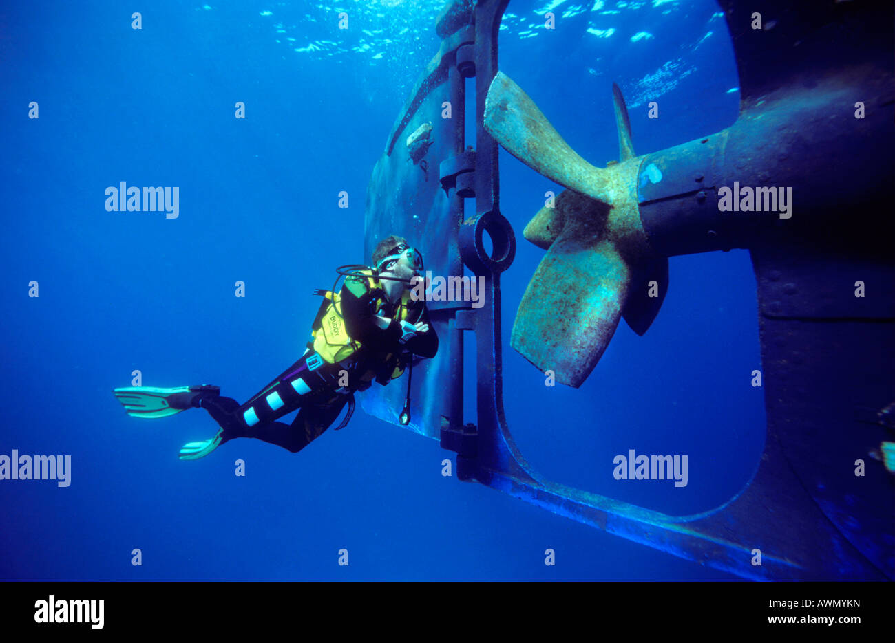Scuba diver inspecting a screw propeller, Red Sea, Egypt, Africa Stock Photo