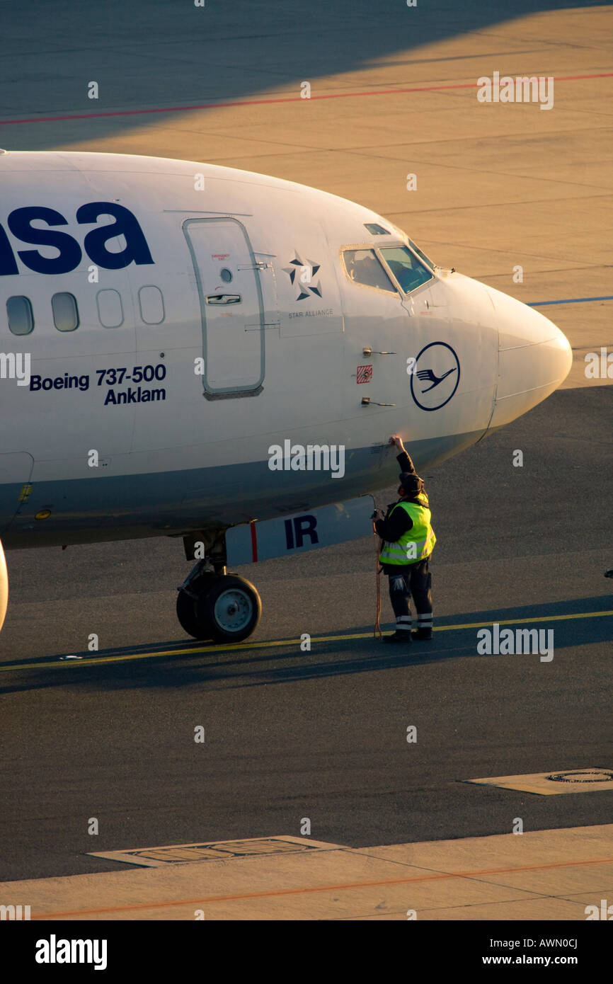 Mechanic checking a Lufthansa airplane before take-off, Frankfurt International Airport, Frankfurt, Hesse, Germany, Europe Stock Photo