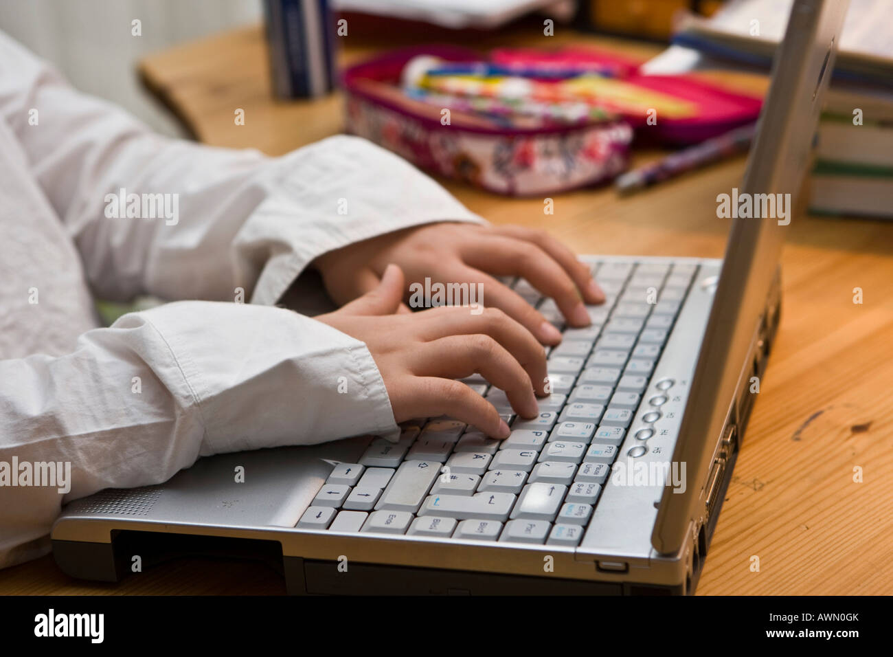 Young schoolgirl working with laptop Stock Photo - Alamy