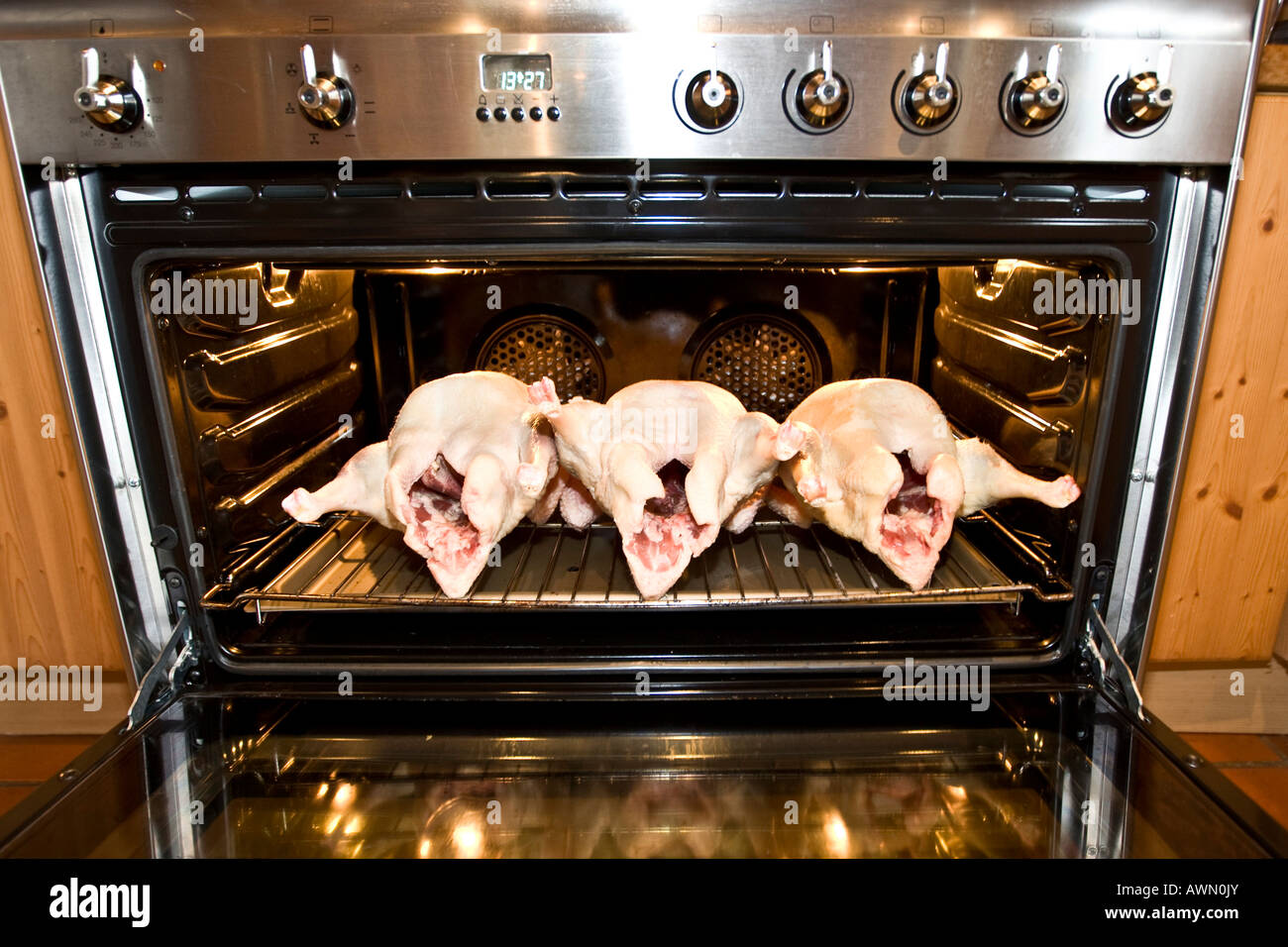 Three prepared geese waiting to be baked, lying in the oven Stock Photo