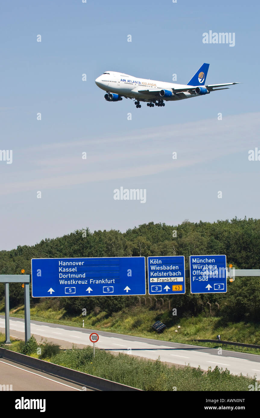 Air Altana Boeing 747 above motorway sign showing the direction to Frankfurt airport, Frankfurt am Main, Hesse, Germany Stock Photo