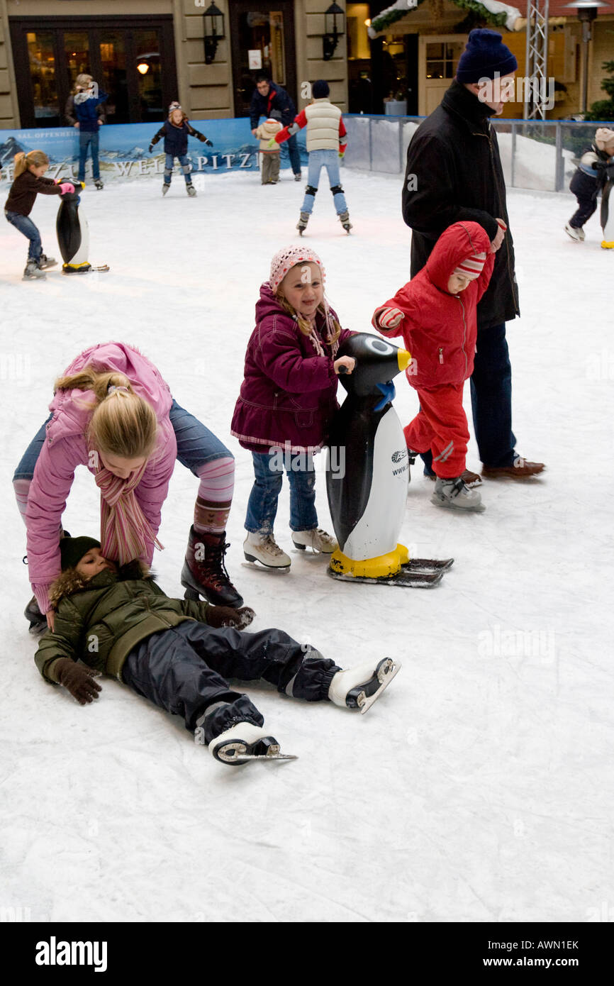 Children skating on artificial rink in the city center, Frankfurt