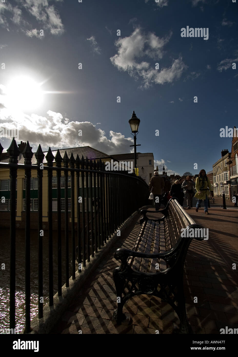 wideangle view of cliffe bridge, lewes, east sussex with bench and blue skies Stock Photo