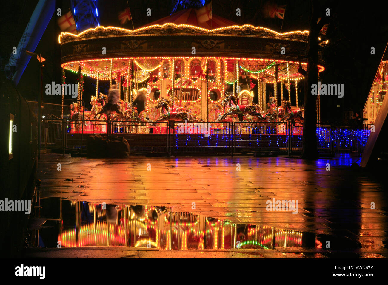 Colorful Carousel and London Eye Millennium Wheel, London, UK Stock