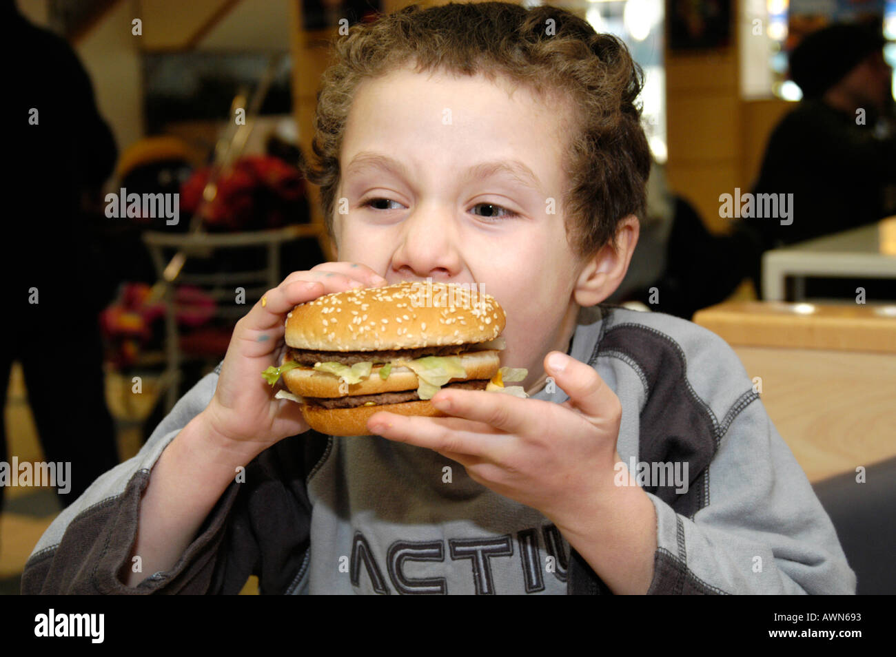Young child eating fast food mcdonalds hires stock photography and images Alamy