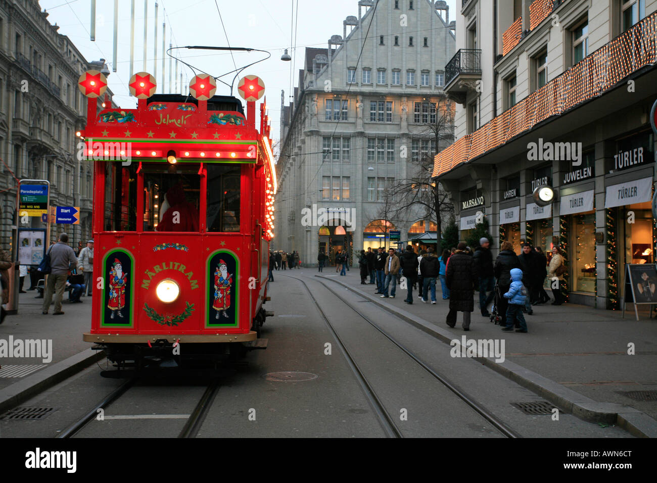 Historic fairytale tram on a round course in downtown Zurich from Bellevue - Limmatquai - Bahnhofstrasse, Zurich, Switzerland Stock Photo