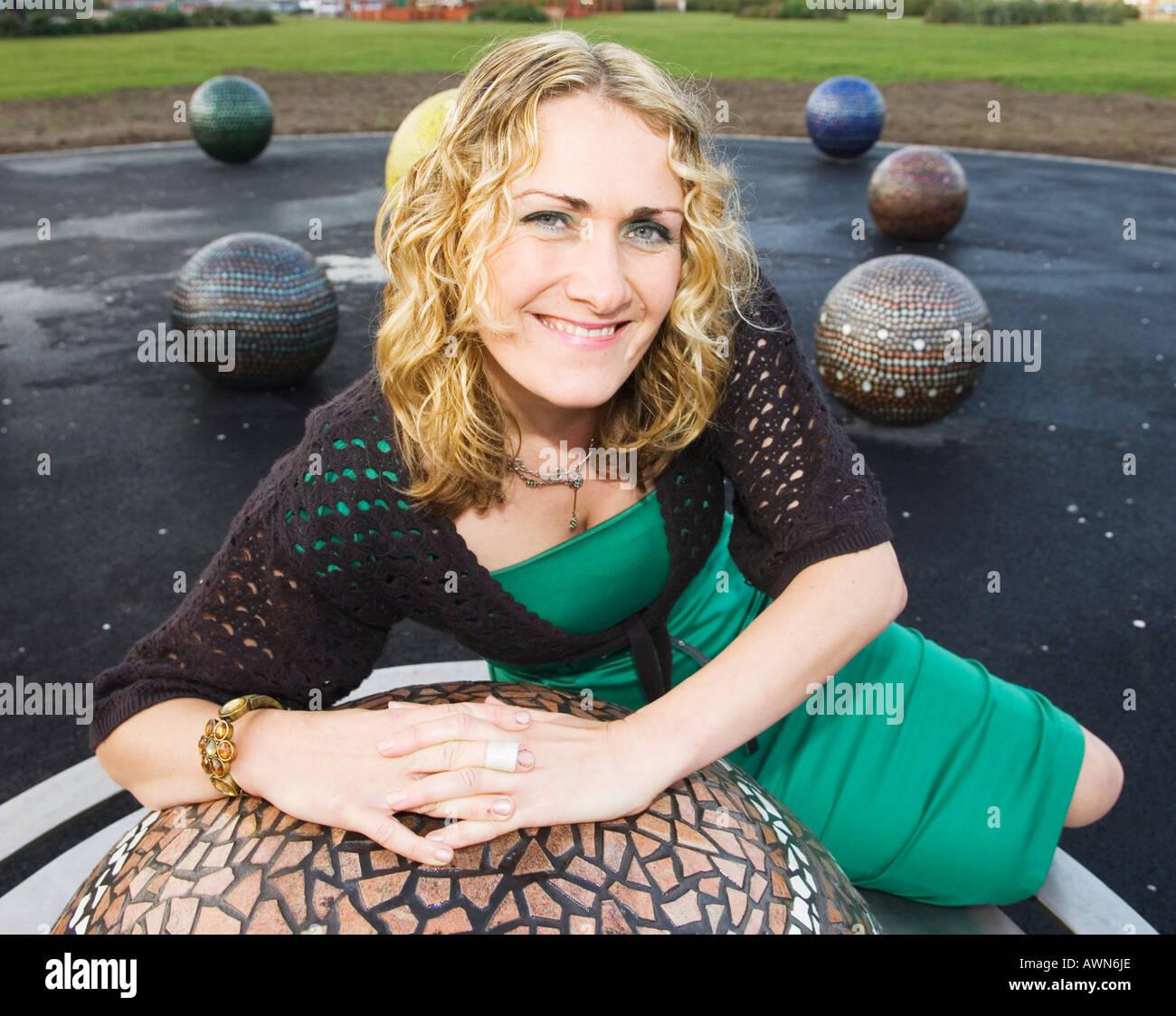 Artist Caroline Murphy with orrery created in the grounds of the Solaris centre,Blackpool Stock Photo