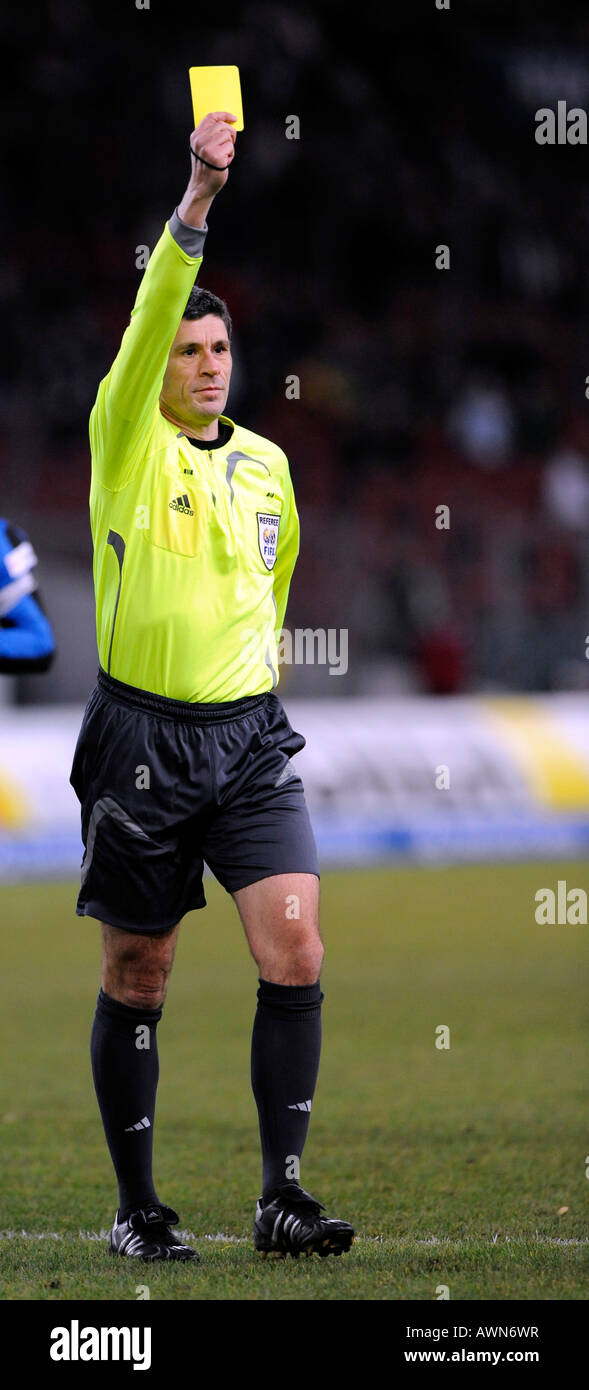 Referee Dr. Markus MERK showing yellow card Stock Photo