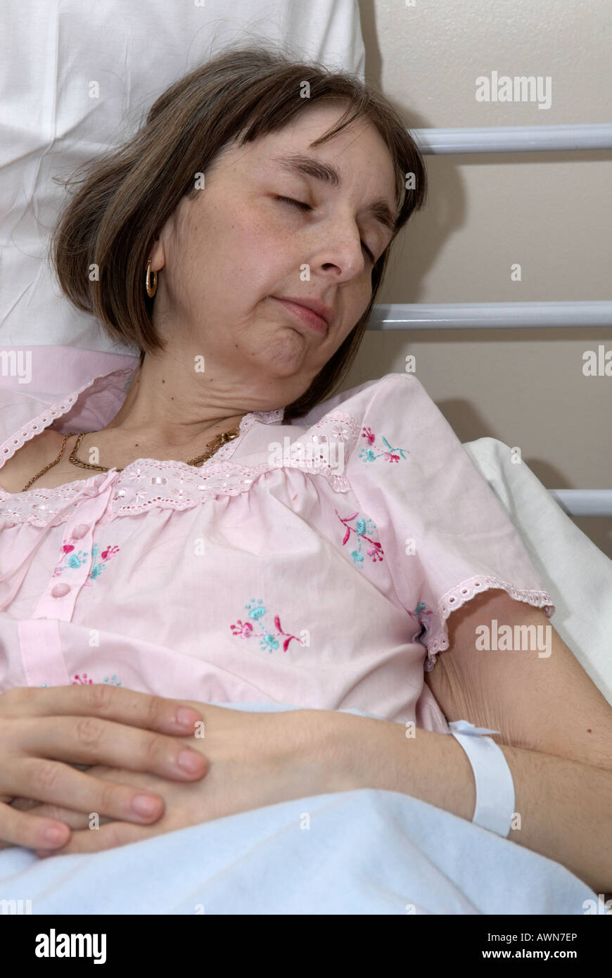 A female patient sleeps in hospital dreaming of going home to be with